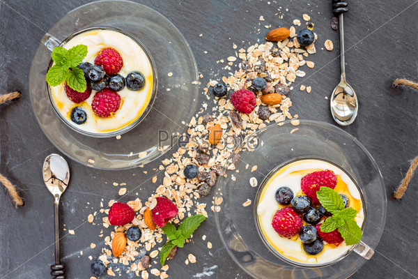 Natural yogurt with fresh berries and muesli, cereal, top view, horizontal composition