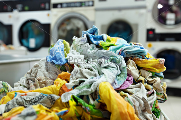 Pile of dirty laundry in laundrette