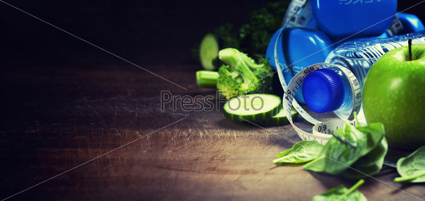 Fresh healthy vegetables, water and measuring tape. Health and d