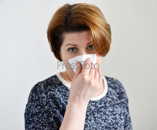Adult woman with a runny nose