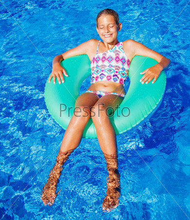 Girl swims in a pool