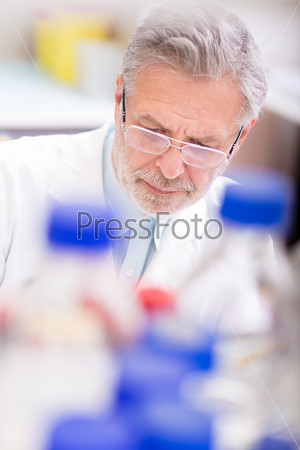 Life scientist researching in laboratory. Life sciences comprise fields of science that involve the scientific study of living organisms: microorganism, plant, animal and human cells, genes, DNA.., stock photo