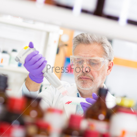 Life scientist researching in laboratory. Life sciences comprise fields of science that involve the scientific study of living organisms: microorganism, plant, animal and human cells, genes, DNA...