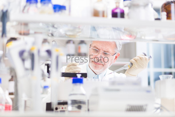 Life scientist researching in laboratory. Life sciences comprise fields of science that involve the scientific study of living organisms: microorganism, plant, animal and human cells, genes, DNA...