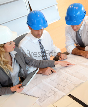 Architects and businesswomen working on construction project