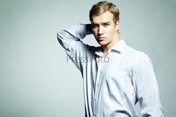 Fashion portrait of young beautiful man on a white background