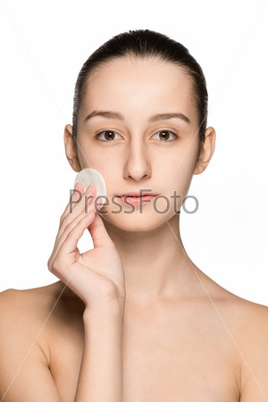 skin care woman removing face with cotton swab pad