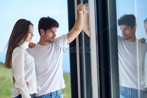 relaxed young couple at home staircase