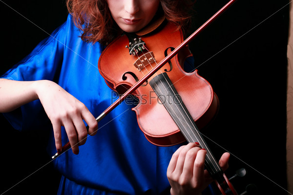 Music portrait of young woman.  Violin play. Close up face beautiful model.