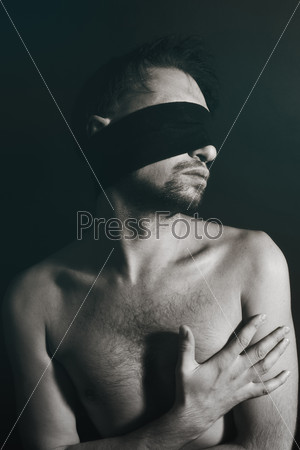 Portrait of nude young men blindfolded on