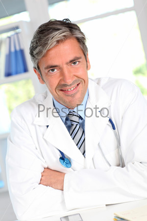 Portrait of handsome smiling doctor