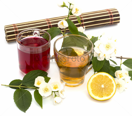 Glass of yellow and red drink, treatment by herbs