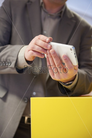 close up photo of business man work on  phone at office