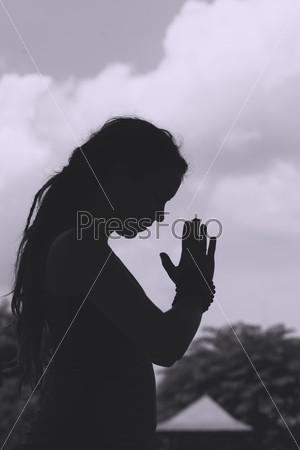 Black and white image of meditating woman