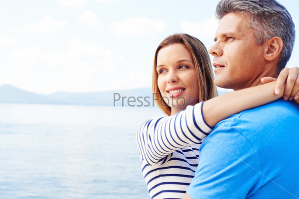 Amorous couple having romantic vacation by the sea