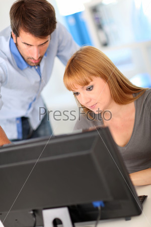 Business people working on desktop computer