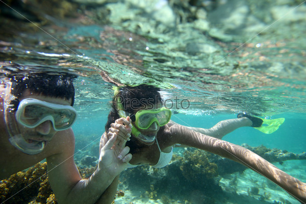 Couple snorkeling in Caribbean waters