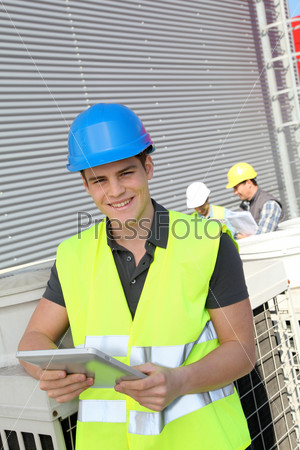 Portrait of young man with security helmet on