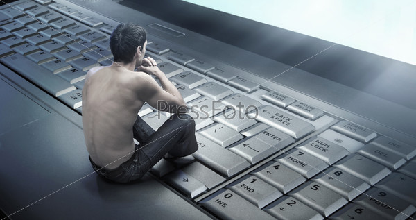 Conceptual photo of a young man addicted to the\
internet