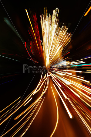Night traffic in the city, car lights in motion blur with zoom effect