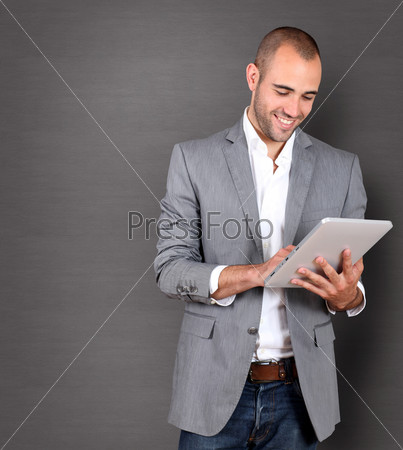 Cool businessman using touchpad