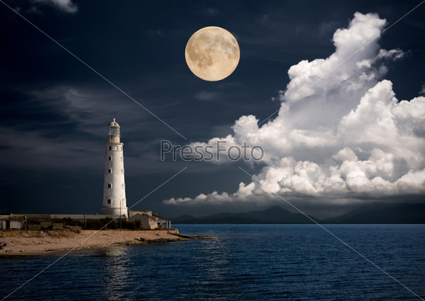 Lighthouse at night, stock photo