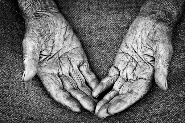 Close-up shot of open palms of old woman, shallow DOF, stock photo