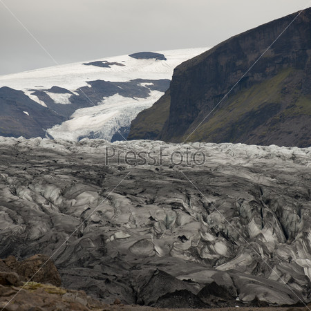 Glacier ice field in mountain valley