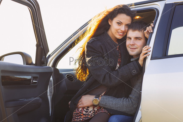 Young smile couple romantic sitting in car