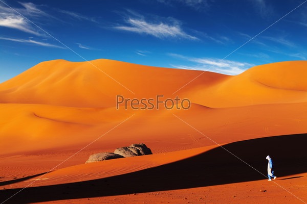 Tuareg in desert at sunset, Sahara Desert, Algeria