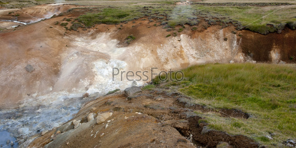 White water river gorge cut into grassland