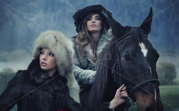 Beauties posing with a horse