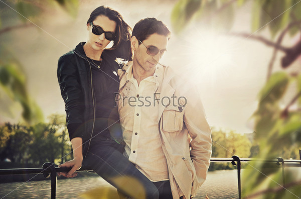 Attractive young couple wearing sunglasses