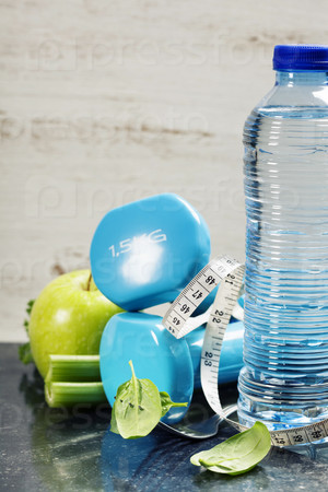 Fresh healthy vegetables, water and measuring tape. Health and d