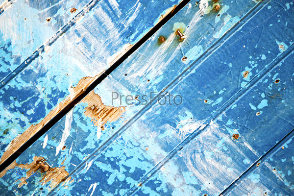 stripped paint in the blue and rusty nail