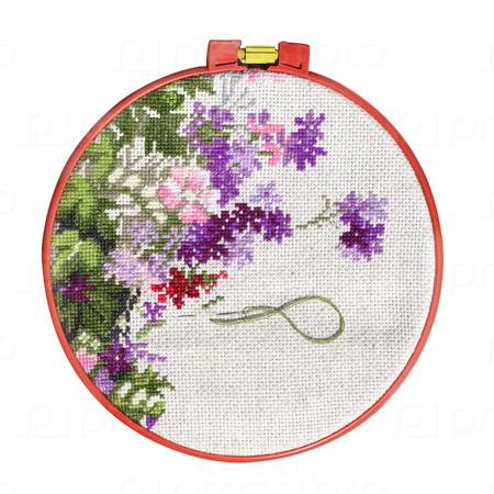 Handmade cross-stitch with floral pattern on canvas