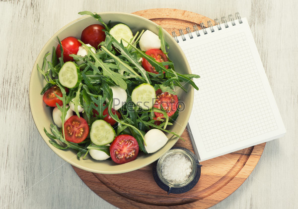 menu, food recipe, blank notepad and vegetable salad