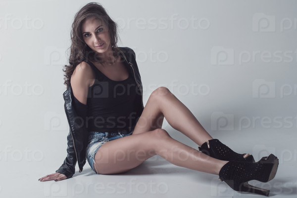 Beautiful and attractive young adult female brunette sensuality woman posing in casual clothes