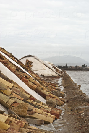A salt mound for salt production with roof tiles in the Trapani,Sicily, Italy