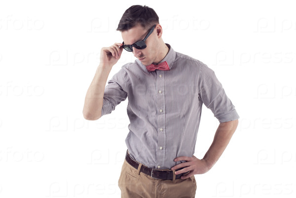 Young man hipster with red bow tie and sunglasses  in shirt with short sleeves
