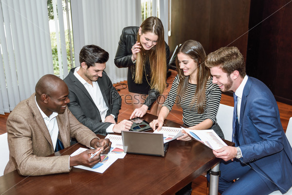 Businesspeople, teamwork. Group of multi-ethnic busy people working in an office