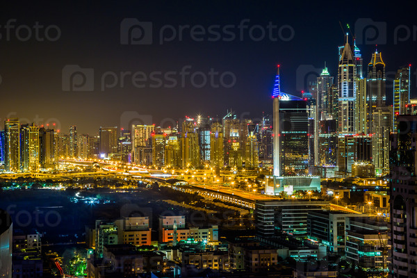 Dubai Downtown Night Scene With City Lights, Luxury New High Tech Town In Middle East, United Arab Emirates Architecture