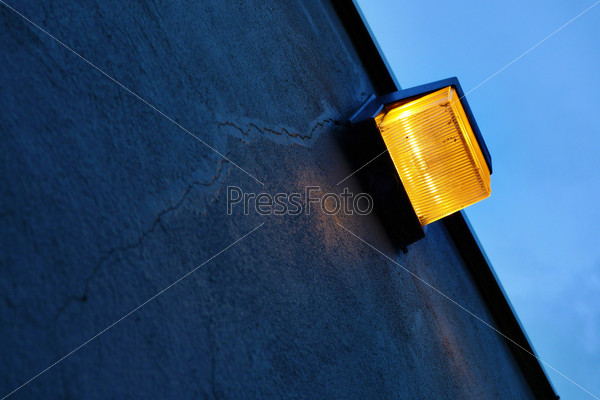 Safety light on cracked cement wall