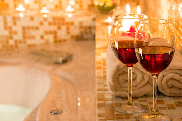 burning candles, glasses of wine for a romantic evening