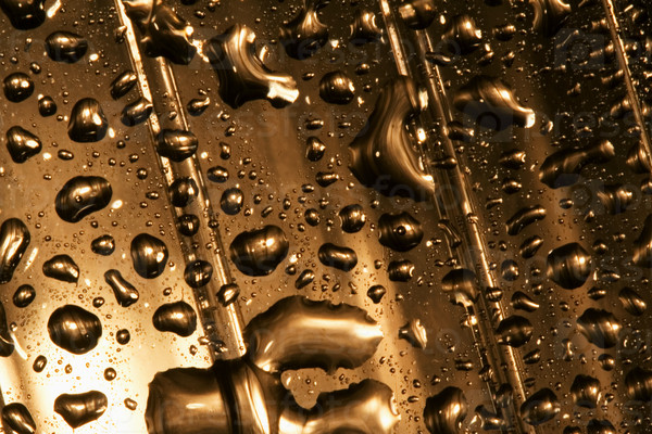 abstract gold drop in a plastic material