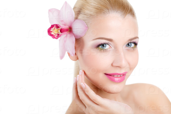 portrait of Beautiful woman With Orchid Flower in her hair.Beautiful Model Woman Face. Perfect Skin. Professional Make-up.Makeup. Isolated on white background