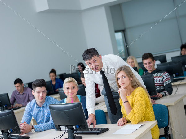 students with teacher in computer lab classrom