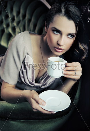 Portrait of a beautiful lady drinking afternoon coffee
