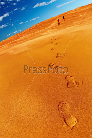 People in desert, stock photo