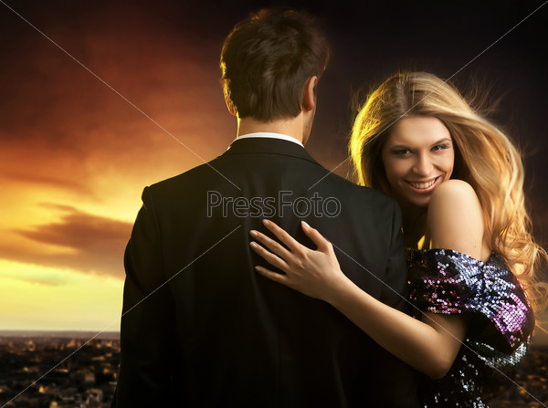 Young couple in elegant evening dresses